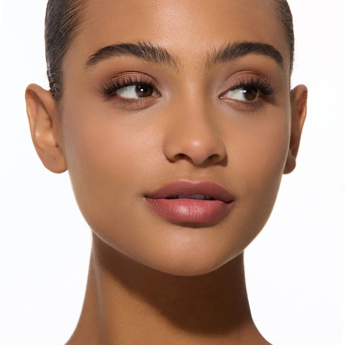 Close-up of a woman's face with neutral background