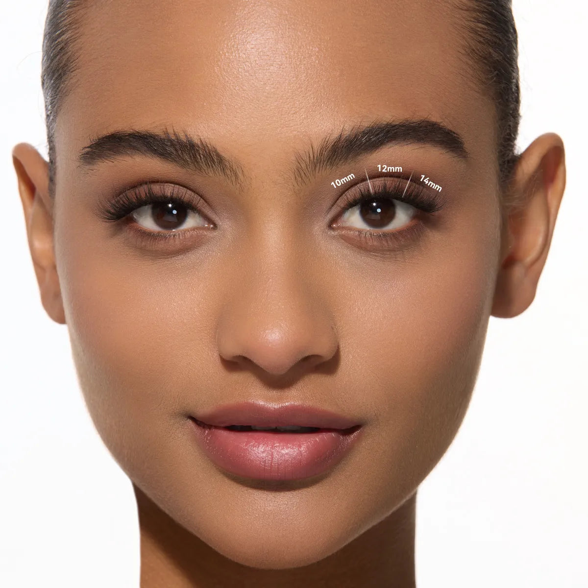 Close-up of a woman's face with labeled false eyelashes on a white background