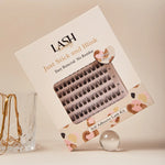 Box of self-adhesive false eyelashes with decorative design on a neutral background